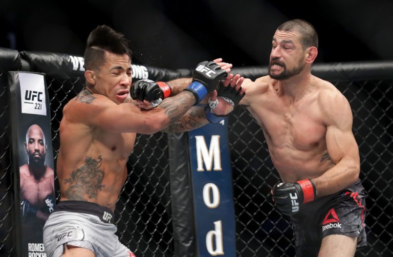 Vinc Pichel punches Joaquim Silva of Brazil during UFC Fight Night at Spectrum Center