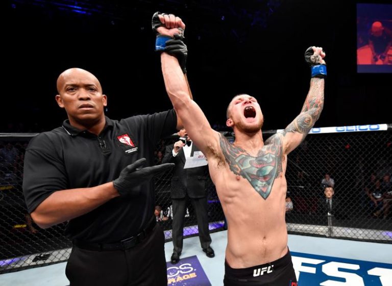 Steven Peterson celebrates after winning a UFC fight