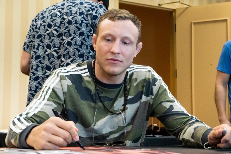 Jack Hermansson signs posters ahead of his UFC main event bout