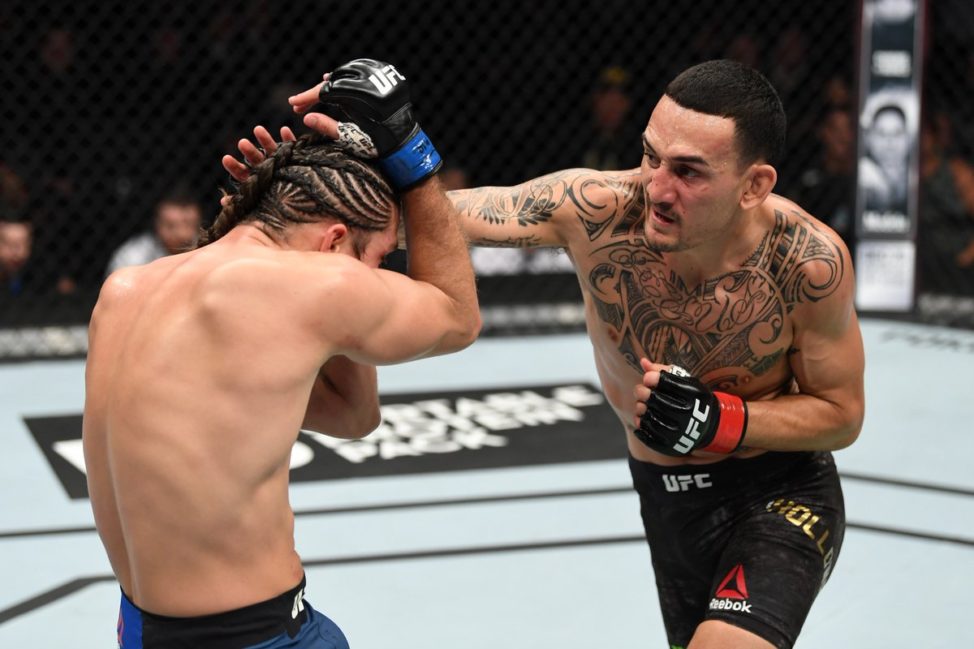 Max Holloway strike Brian Ortega at UFC 231