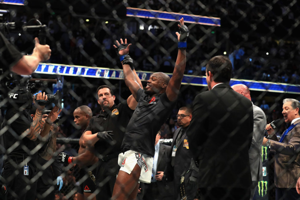 Jon Jones reacts to defeating Daniel Cormier in the Light Heavyweight title bout during UFC 214