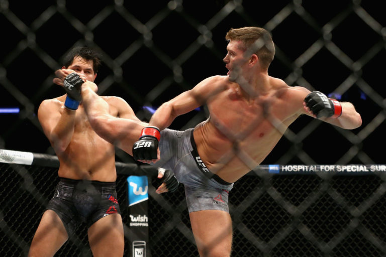 Stephen Thompson.kicks Jorge Masvidal in their welterweight bout during the UFC 217