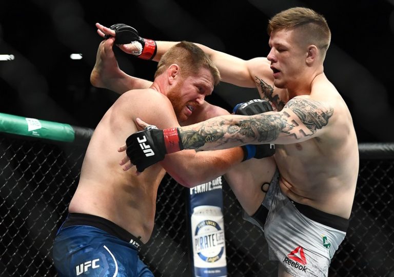 Jim Crute lands a kick in his fight against Sam Alvey in their Light Heavyweight fight during UFC234