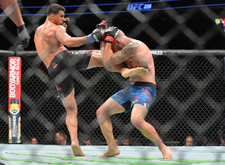 Drakkar Klose (L) kicks Lando Vannata during their lightweight fight at T-Mobile Arena