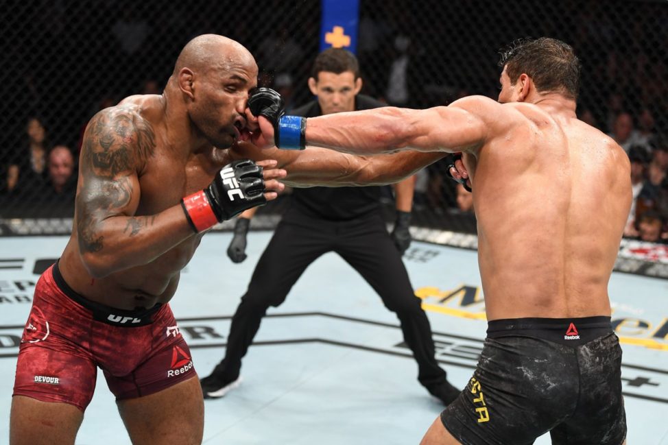 Paulo Costa drills Yoel Romero with a left hand