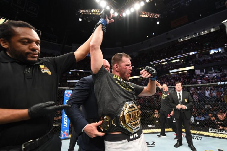 Stipe Miocic celebrates with the UFC Heavyweight Championship after UFC 241