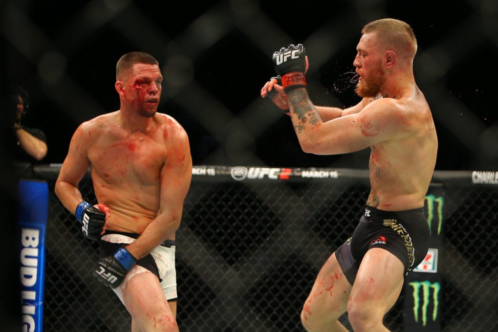 Nate Diaz punches Conor McGregor during UFC 196 at the MGM Grand Garden Arena on March 5, 2016