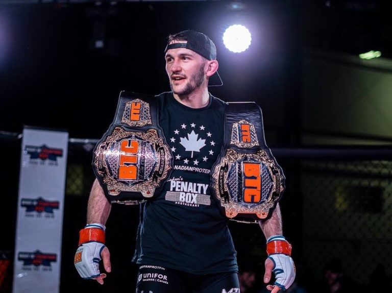 Kyle Prepolec with two titles on his shoulders
