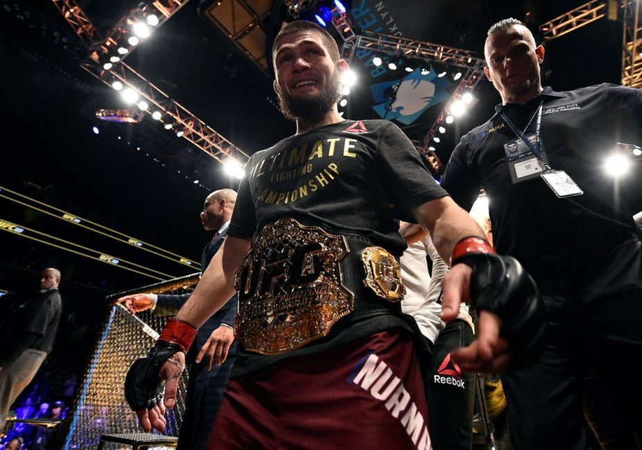 Khabib Nurmagomedov walks out with the UFC Lightweight Championship following his win