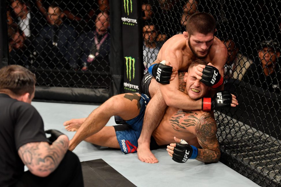 Khabib Nurmagomedov looks to sink a rear-naked choke against Dustin Poirier
