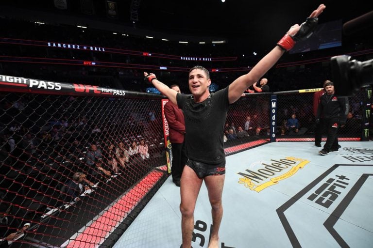 Diego Sanchez celebrates in the UFC Octagon