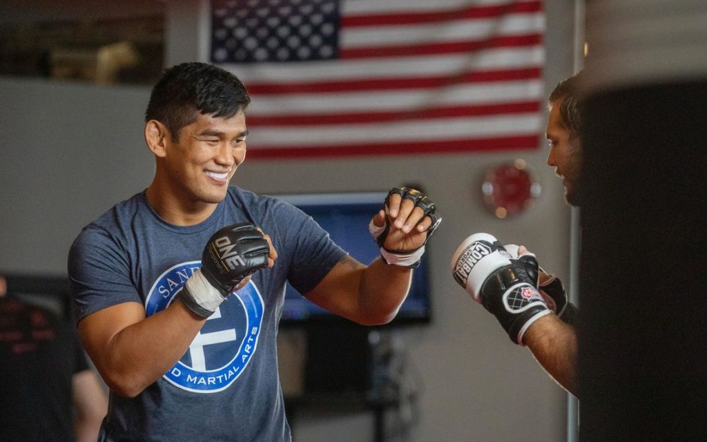 Aung La N Sang spars with a partner at Sanford MMA's press day