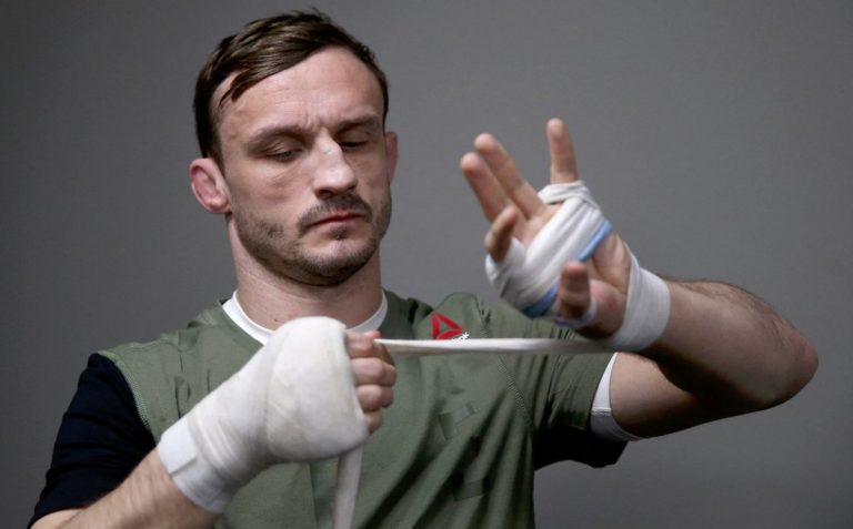 Brad Pickett wraps his hands before a UFC Fight