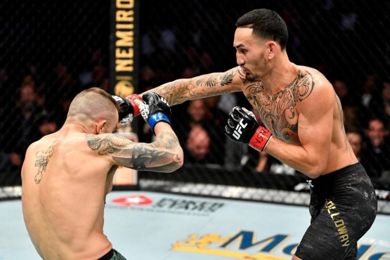 Max Holloway strikes Alexander Volkanovski at UFC 245