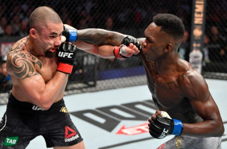 Israel Adesanya crushes Rob Whittaker with a right hand