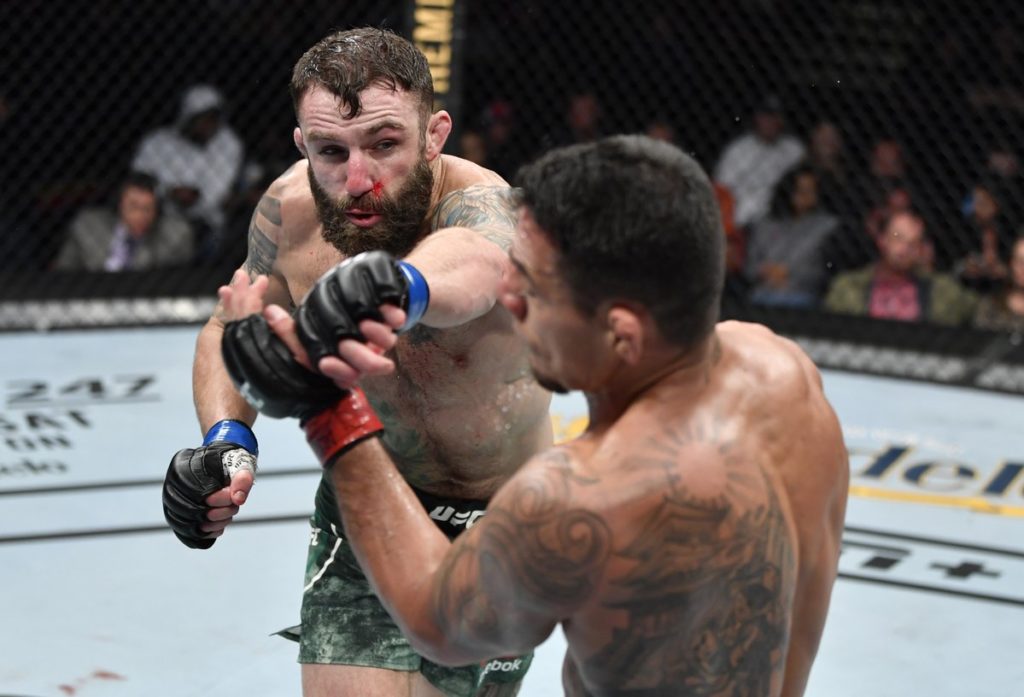 Michael Chiesa strikes Rafael dos Anjos during UFC Raleigh