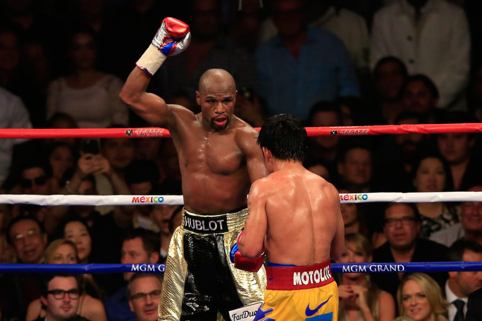 Floyd Mayweather Jr. reacts in the 12th round during the welterweight unification championship bout
