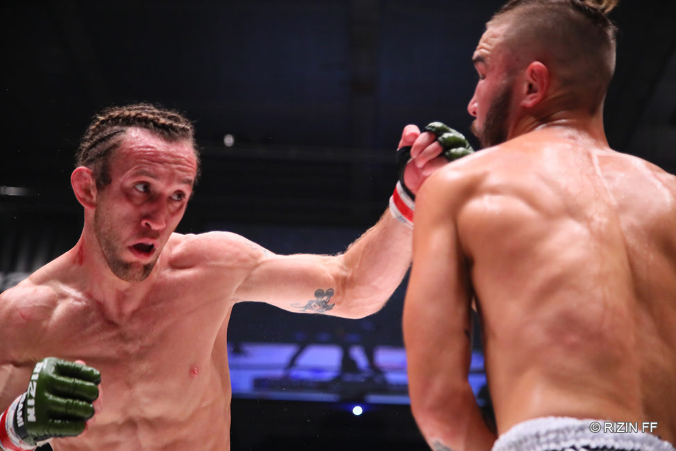 Victor Henry punches Trent Girdham at RIZIN 18.