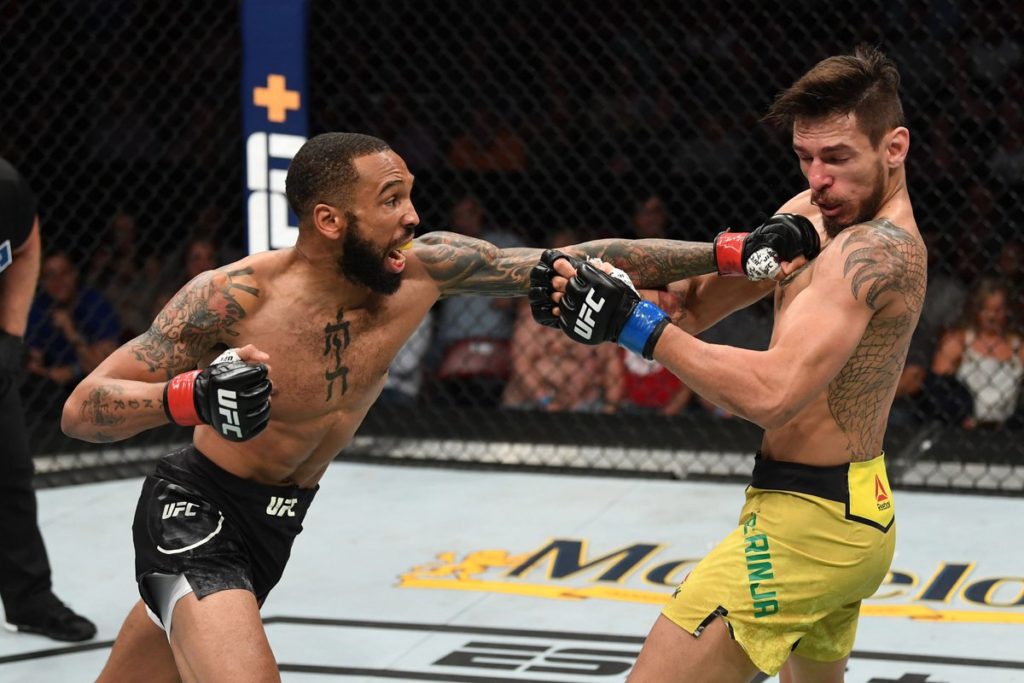 Andre Ewell lands a strike in the UFC