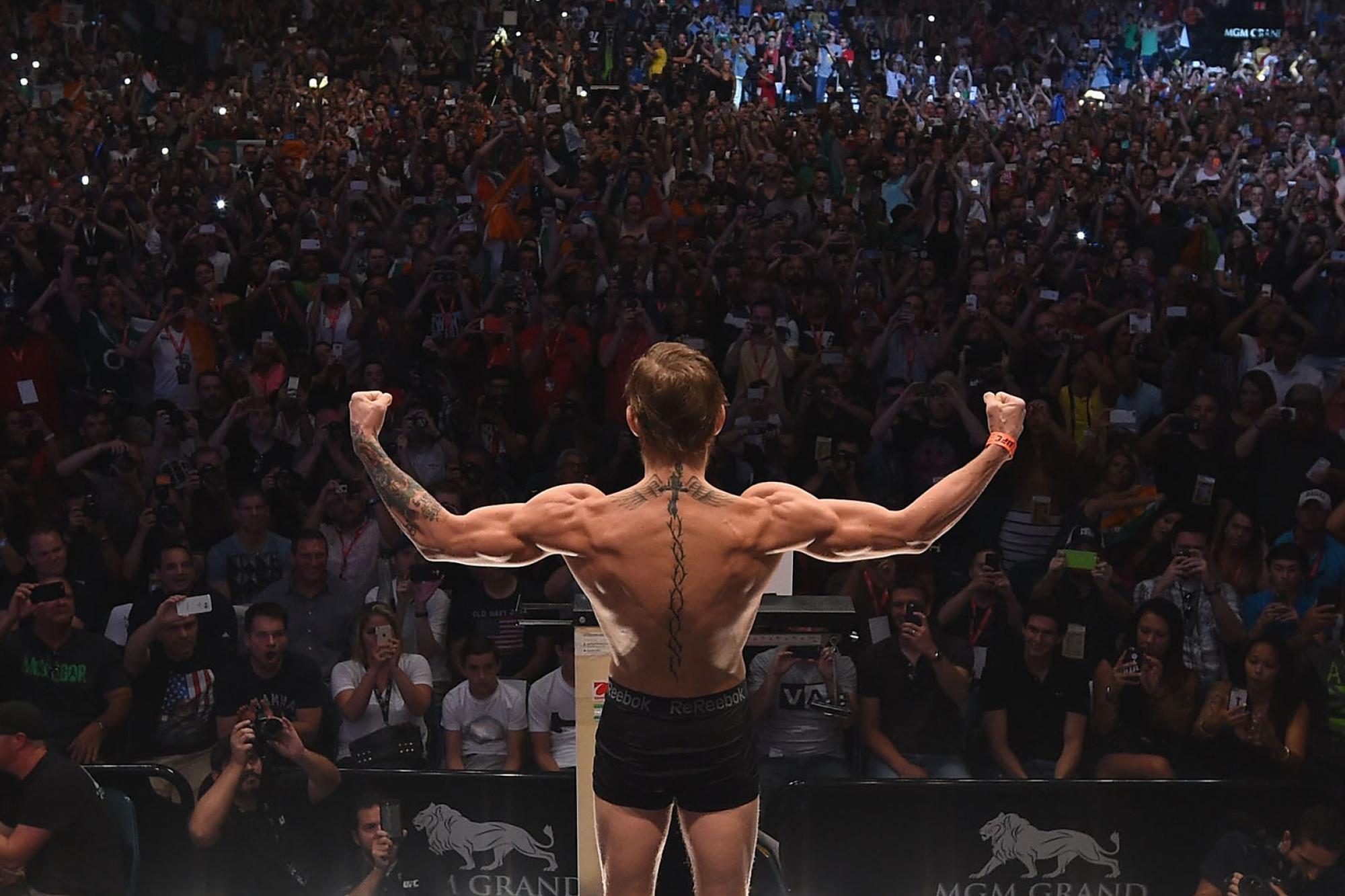 Conor McGregor steps onto the scale during the UFC 189 weigh-in inside MGM Grand Garden Arena on July 10, 2015 hero
