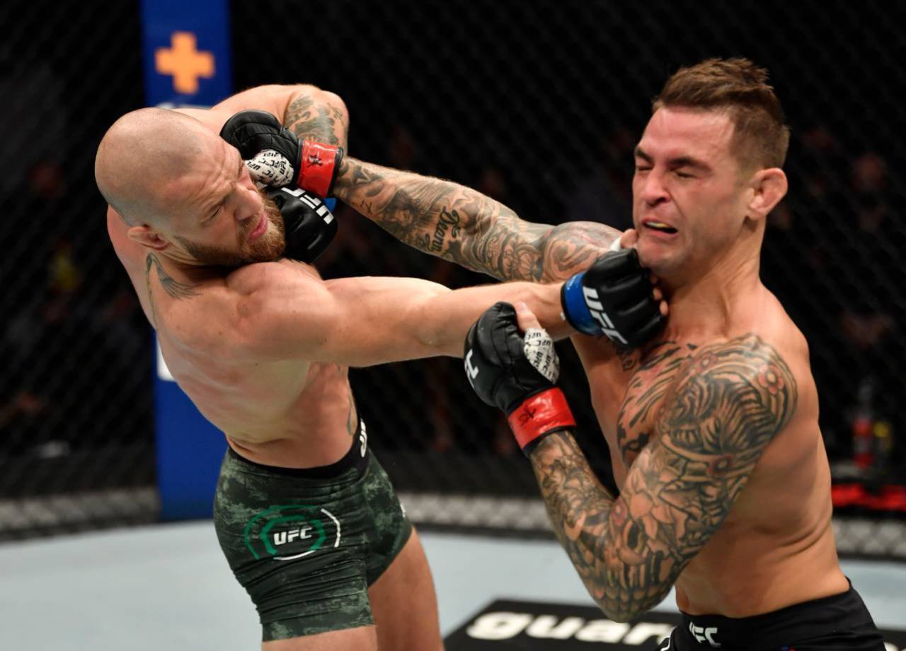 Conor McGregor and Dustin Poirier trade punches at UFC 257 (Zuffa LLC)