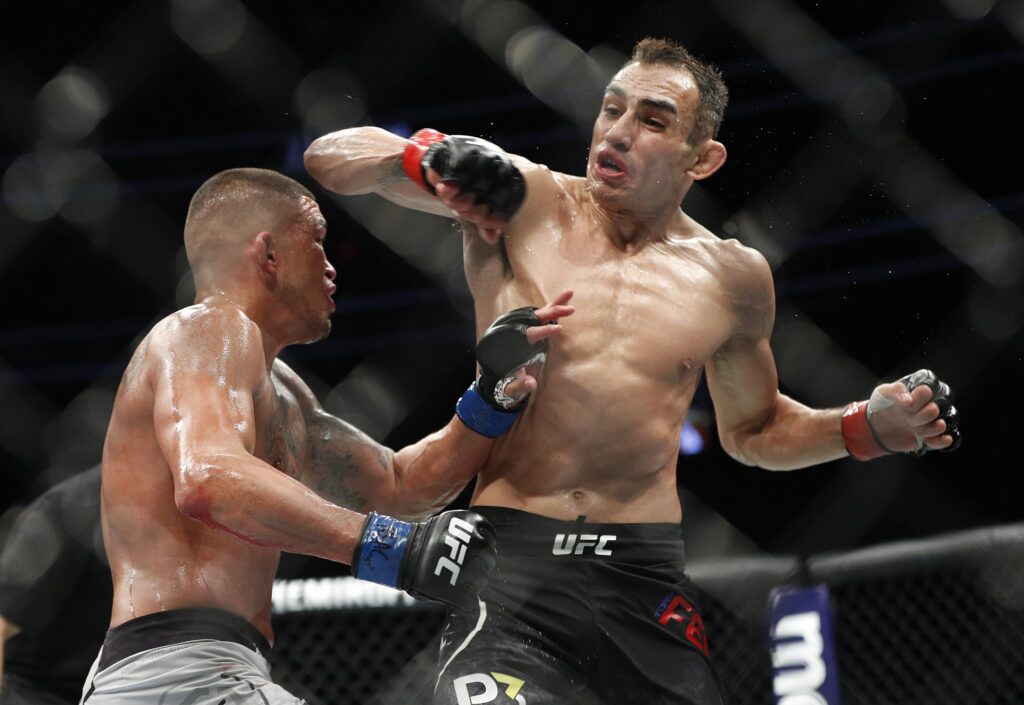 Tony Ferguson throws a spinning elbow at Anthony Pettis (Zuffa LLC)