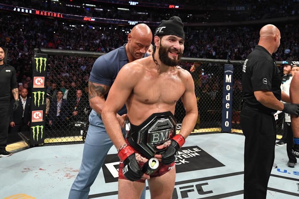 Dwayne "The Rock" Johnson straps the UFC BMF Title around Jorge Masvidal's waist at UFC 244 (Zuffa LLC)