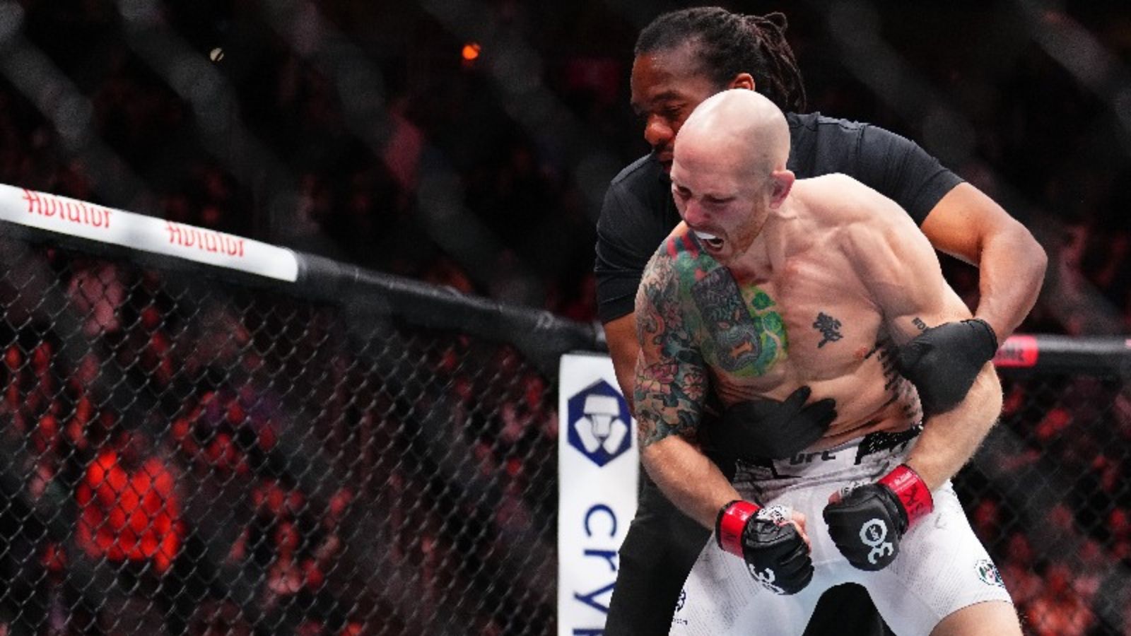 Josh Emmett celebrates his stunning knockout victory over Bryce Mitchell at UFC 296
