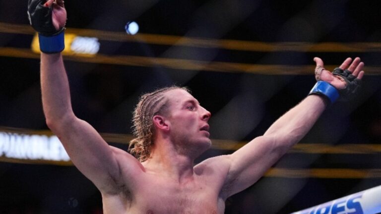 Paddy Pimblett celebrates his victory at UFC 296
