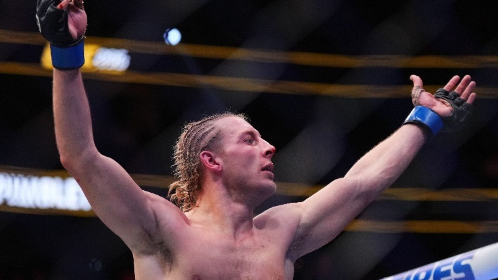 Paddy Pimblett celebrates his victory at UFC 296